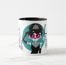 Load image into Gallery viewer, Mug to transform your morning routine into an elegant ritual with our Ceramic &quot;Breakfast at Tiffany&#39;s&quot; Mug. Designed by La Catrina Bohemia, this mug features a captivating recreation of the iconic Breakfast at Tiffany&#39;s scene, printed with the unmistakable Bohemian aesthetic. 
